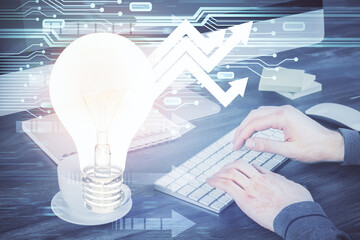 Growing arrows with businessman working on computer on background. Success concept. Double exposure.