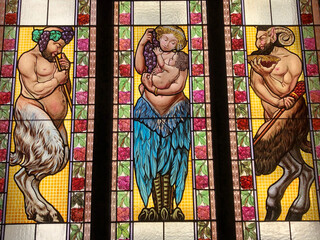 Fototapeta na wymiar Satyrs and Nymph stained glass