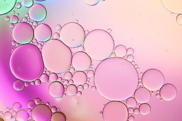 Colorful artistic of oil drop floating on the water. Abstract pastel bubble background.