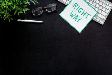 Right way icon on black office desk top view copy space