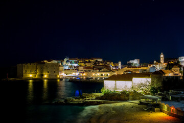 Panoramic wide cityscape scene, long exposure at night. Scenery winter view of Mediterranean old city of Dubrovnik, European travel and historic destination, Croatia