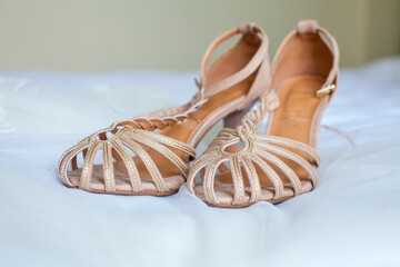 women's shoes on the bed sandals with heels