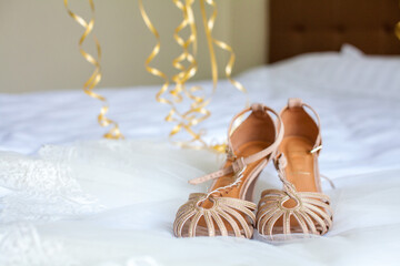 women's shoes on the bed sandals with heels
