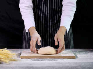 Hands preparing bread dough, kneading the dough. Hands with flour splash, food homemade bakery concept