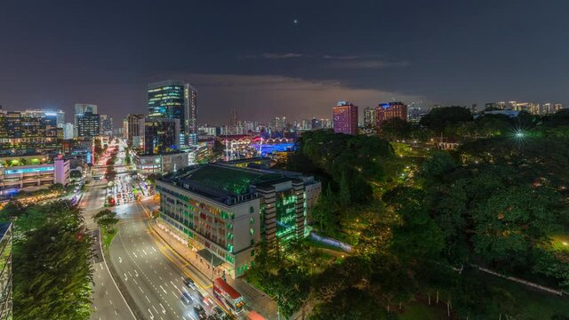 City skyline with Old Hill Street Police Station historic building in Singapore day to night transition aerial timelapse. Fort Canning Park and skyscrapers with New Bridge road on a background