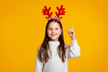 Great idea. Cheerful girl shows thumb up to free space