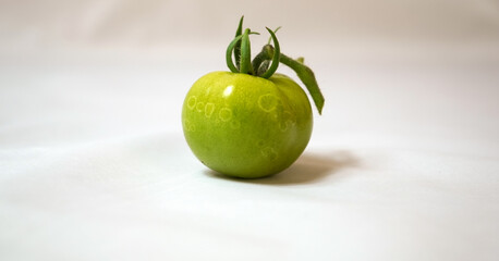 green tomato on a table