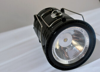 Black plastic lantern for fishing and home on a white background.