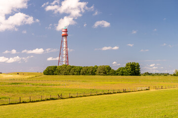 Fototapeta na wymiar view on the lighthouse of campen near emden, north sea, germany
