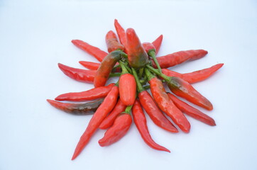 bunch the red ripe chilly isolated on white background.