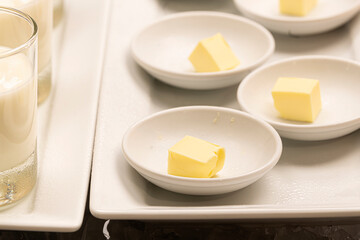 Butter pieces in white bowl in a buffet Restaurant or Hotel. Selective focus