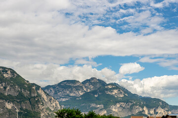 The Alps north of Trento in the Paganella and Mezzocorona area, Trentino, Italy, against a dramatic sky