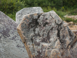 big stone close-up texture of old stone and lichen moss