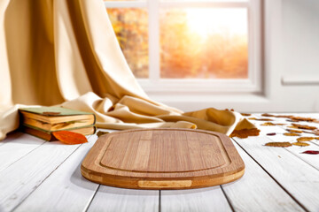 Obraz na płótnie Canvas Desk of free space and blurred autumn window background 
