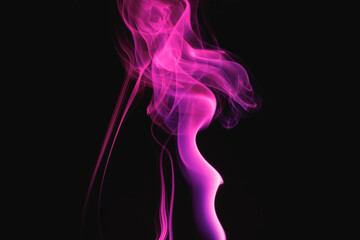 Obraz premium Purple smoke on a black background. Colored smoke. Incense stick smoke illuminated by purple light.