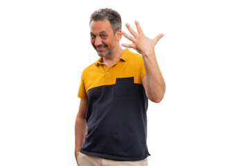 Friendly cheerful male showing five fingers as counting gesture