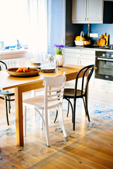 Living room and kitchen in country house, beautiful interior design, light room
