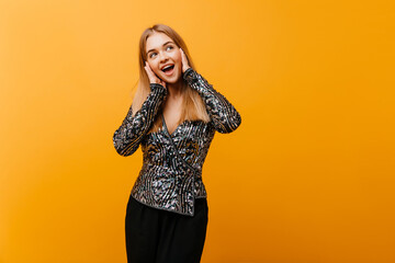 Fototapeta premium Pretty shapely woman posing with happy smile. Indoor portrait of cute european girl in elegant party outfit.