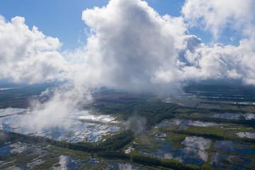 Aerial view of flooded Seda swamp (Sedas purvs) water lakes and clouds