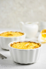 Rice millet porridge in baking dishes. Space for text.