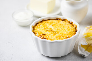 Baked millet rice porridge, casserole in baking dishes. Space for text.