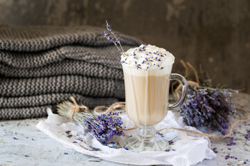 Hot lavender raf latte cappuccino with dried lavender on wooden table. Good Morning concept. Selective focus.