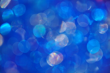 Drops of water defocus on a dark blue background. Colorful beautiful abstract background bokeh.Bokeh Blurred light effect background from light blue to dark blue.