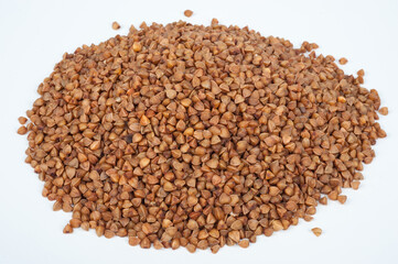 a pile of buckwheat on a white background