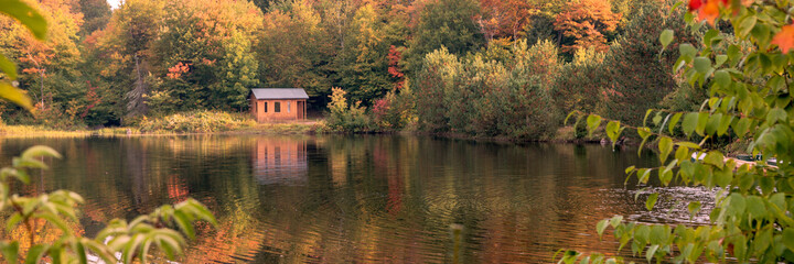 Fototapeta na wymiar Autumn forest lake reflection landscape. Panorama