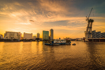 Obraz premium Bitexco Financial Tower building, buildings, roads, Thu Thiem 2 bridge and Saigon river in Ho Chi Minh city - This city is a popular tourist destination of Vietnam.
