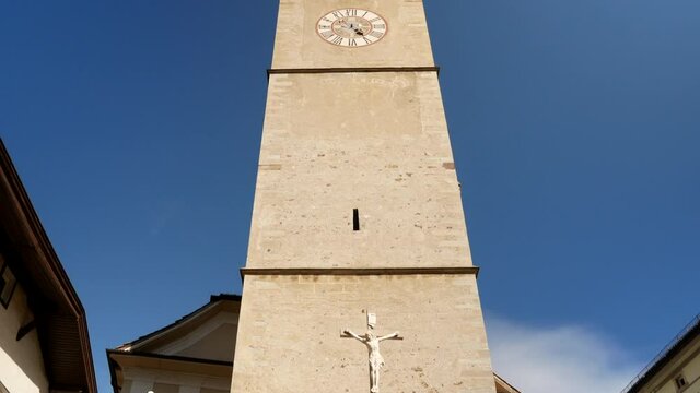 Historic old church in Kaltern,Italy during beautiful sunny day.Tilt up shot.
