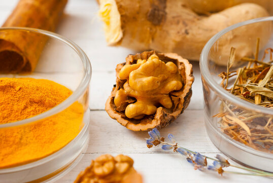 Spices and herbs on white wood table
