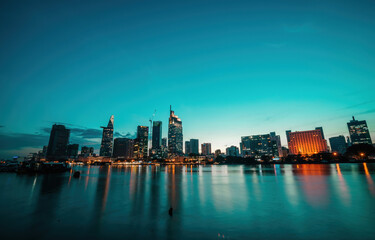 Fototapeta premium Bitexco Financial Tower building, buildings, roads, Thu Thiem 2 bridge and Saigon river in Ho Chi Minh city - This city is a popular tourist destination of Vietnam.