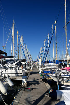 Sailing boats viewed from the pier in the marina