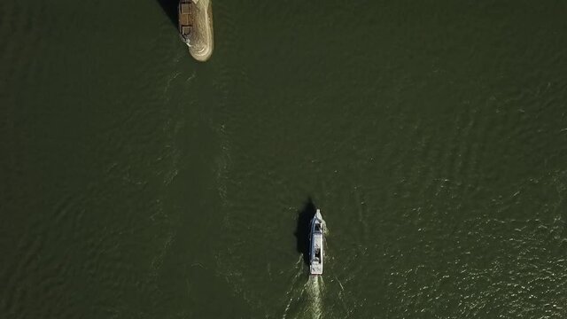 a flying camera chases a passenger boat on the ob river in siberia