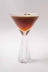 Cocktail with coffee liqueur and coffee beans.