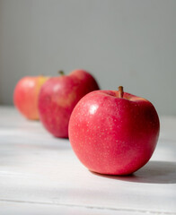 red apples on wooden table
