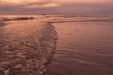 Beautiful waves on the beach with in sunrise.