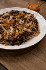 Vietnamese Pork Combination Pizza with Dipping Sauce on Wooden Table