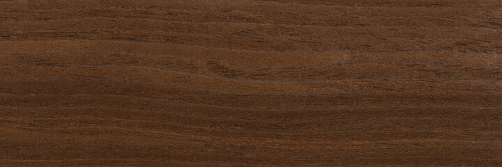 Natural oak veneer background in expensive dark brown color. Natural wood texture, pattern of a long veneer.