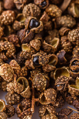 fragrant Sichuan pepper on white acrylic background