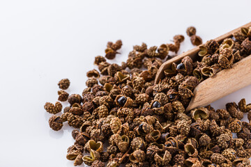 fragrant Sichuan pepper on white acrylic background
