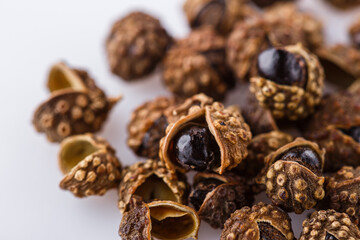 fragrant Sichuan pepper on white acrylic background