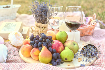 Fresh fruits and wine glass picnic outdoors. Close up tasty food lifestyle naturals