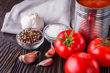 juicy canned tomatoes on wooden rustic background