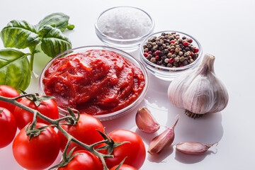 fresh natural tomato paste on a white background