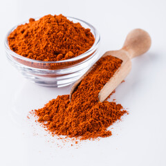 aromatic spicy chili powder on a white background