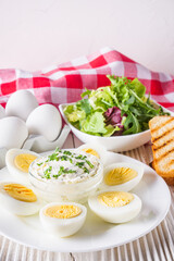 boiled chicken eggs on a white wooden rustic background