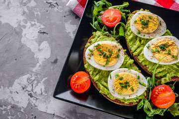 tasty and nutritious avocado sandwich and boiled egg