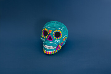 blue skull of a day of dead on a blue background